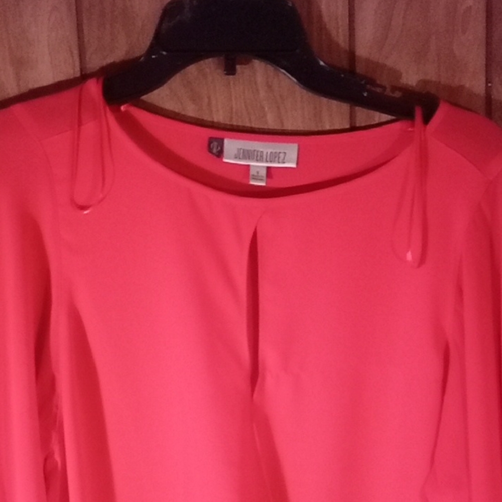 Jennifer Lopez Vibrant Coral Top